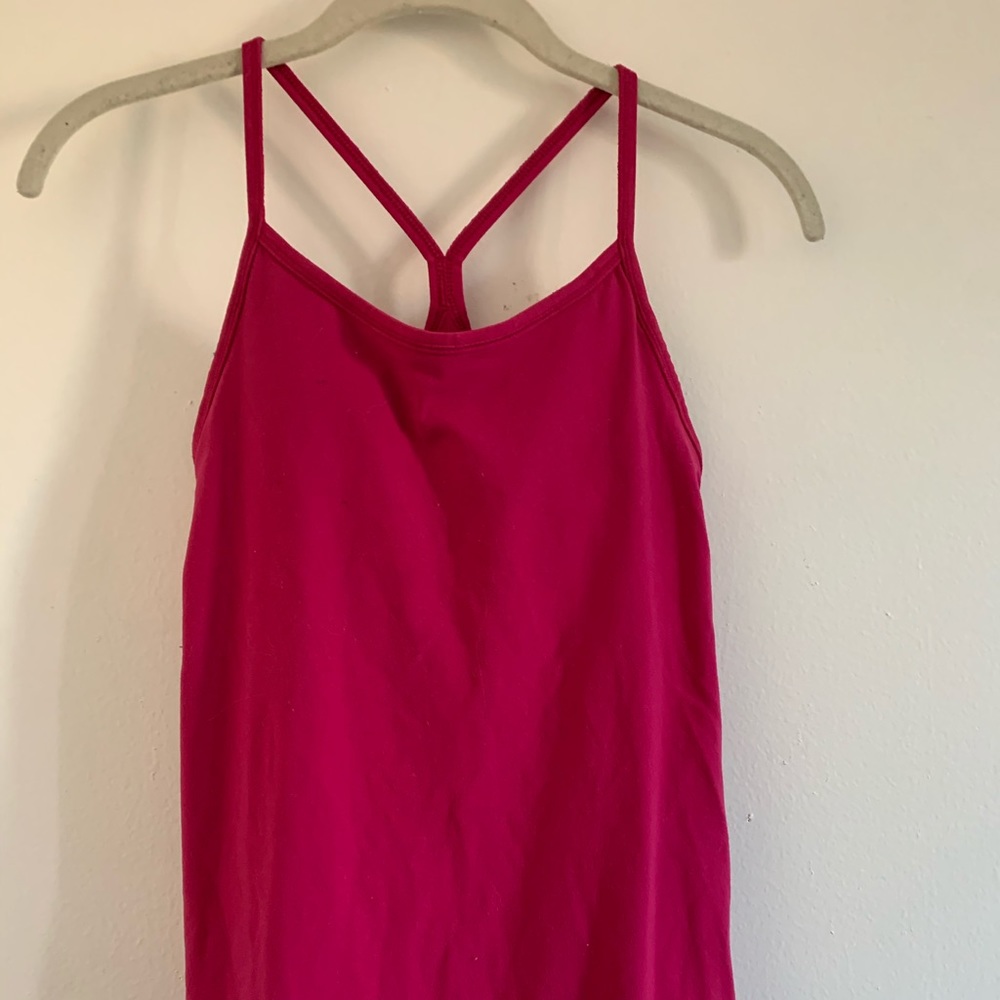 Pink Nike sports top with built in bra